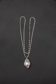 A White Gold Necklace With Pearl Pendant