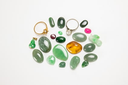 A Group Of Twenty Two Mix Jadeite, Tourmaline, Jade, Agate And 18k Glod Ring.