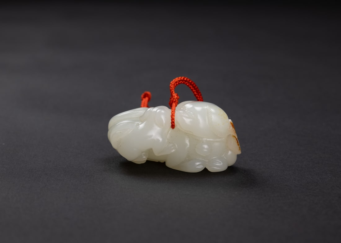 A Fine Russet White Carved ‘ Two Lions’ Pendant. (1 of 5)