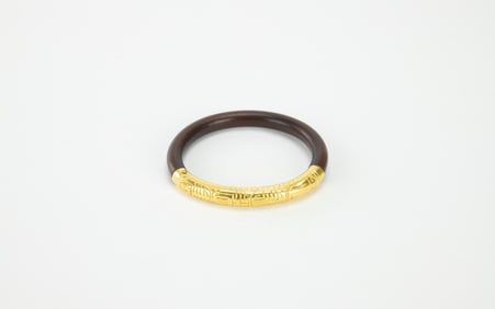 An Agarwood Mounted 24k Gold Bangle
