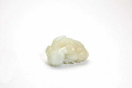 A White Jade Carving of a Recumbent Lion, Late Qing