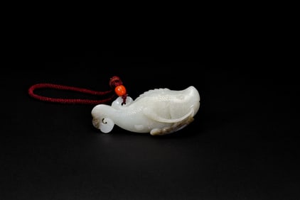 A White Jade Carved ‘Carp with Lotus’ Pendant. LateQing/Republic