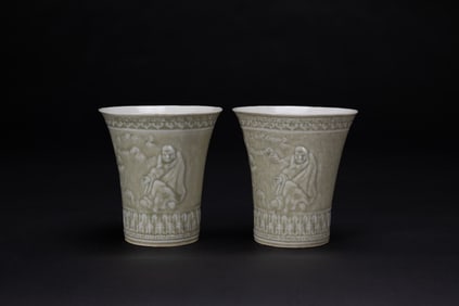 A Pair Of Gray Green Glazed Molded’Arhat And Shou’ Cups,