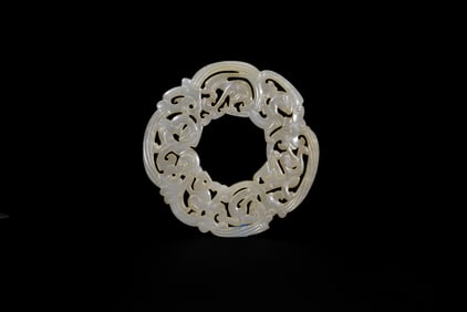 A Finely Carved Openwork Jade Bi Disc with Chilong and Phoenix. Han Dynasty