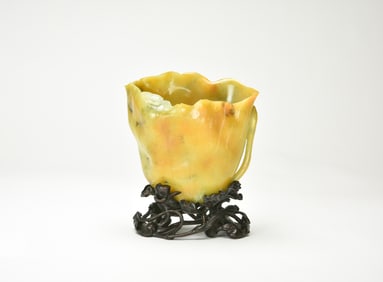 A Finely Carved Yellow Jadeite ‘Lotus Leaf ’ Vase with Wood Stand, Late Qing / Republic.