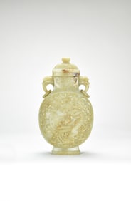 A Finely Carved Celadon and Russet Jade ‘Dragon’ Vase and Cover, Qing Dynasty