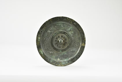 A Bronze Mirror with Auspicious Beasts. Han Dynasty (206 BC – AD 220).