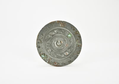 A Bronze Mirror with Bird and Serpent Motifs, Han Dynasty (206 BC – AD 220).