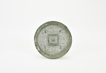 A Bronze Mirror with Auspicious Beast Design, Tang Dynasty (AD 618–907).