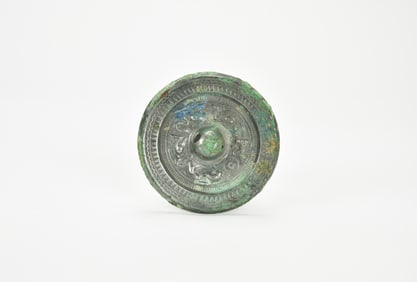 A Bronze Mirror with High-Relief Dragon and Tiger MotifsChina, Han Dynasty (206 BCE – 220 CE).