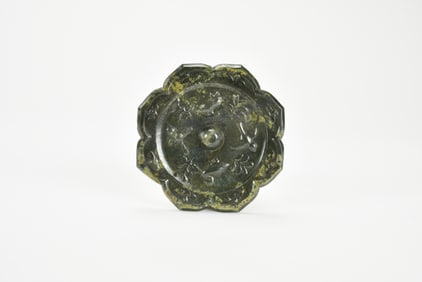 A Chinese Bronze Octafoil Mirror, Tang Dynasty (618–907).