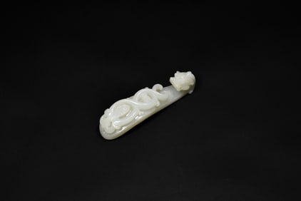 A Finely Carved White Jade Belt Hook with Incised Geometric Decoration, Qianlong Period, (Mid-18th