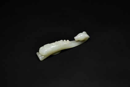 A Celadon-White Jade ‘Ram-Head’ Belt Hook with Eight Treasures Design, Qing Dynasty, 18th–19th