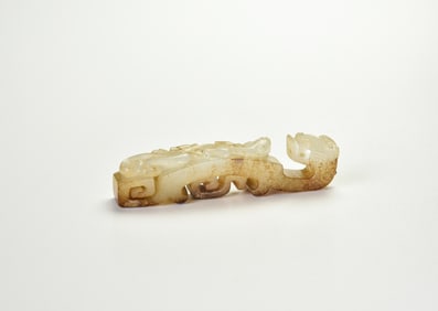 A White Jade Belt Hook with Chilong Design and Russet Inclusions, Western Han Dynasty (2nd Century
