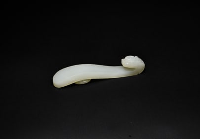 A Finely Carved White Jade Belt Hook with Dragon Head, Qianlong Period (1736–1795)
