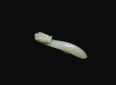 A Celadon Jade ‘Dragon’ Belt Hook, Late Ming to Early Qing Dynasty, 17th–18th Century