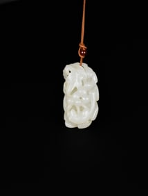 A White Jade Pendant Carved with Squirrel and Grapes, Qing Dynasty (18th–19th Century)