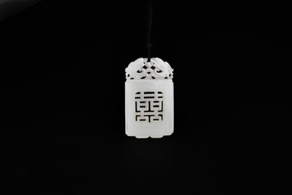 A White Jade Openwork Pendant Carved with Chi Dragons and ‘Double Happiness’ Motif, Qing Dynasty
