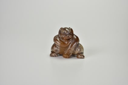 A Brown Jade Figure of a Bear, Han Dynasty (circa 2nd Century BC – 1st Century AD)