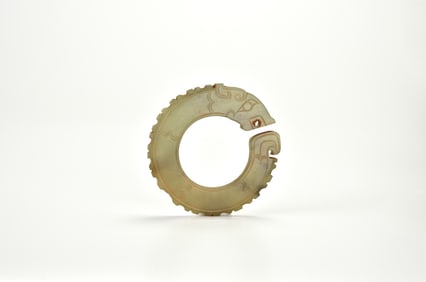 A Rare Celadon Jade Dragon-Head RingWestern Zhou Dynasty (circa 1046-771 Century BC)