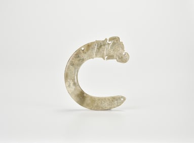 A Rare Archaic Celadon Jade Hook-Shaped Ornament with Animal Head, Shang Dynasty (circa 13th–11th