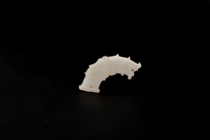 A Rare Jade Pendant Carved as a Human Head with High CrownShijiahe Culture, ca. 2500–2000 BC.