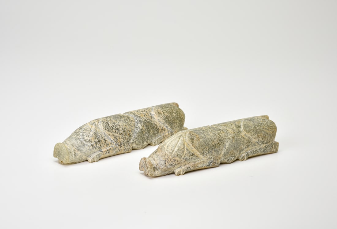 A Pair Of Celadon Jade Pigs (Yu Zhu) Han Dynasty (206 Bce – 220 Bce): A Pair Of Celadon Jade Pigs (Yu Zhu) Han Dynasty (206 Bce – 220 Bce)Each pig is finely carved in the round from a translucent celadon-green jade, the bodies rendered in recumbent pose with short