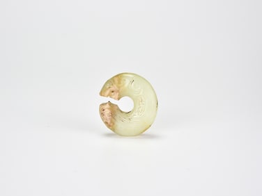 A Rare Archaic Yellow Jade ‘Coiled-Tail Tiger’, Shang Dynasty (c. 13th–11th century BCE)