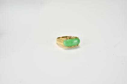 A Jadeite and 14k Gold Ring.