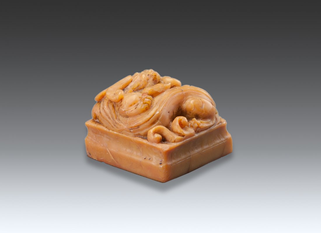 A Soapstone Carved ‘Dragon’ Seal: A Soapstone Carved ‘Dragon’ Seal 4 x 4 x 3 cm. (1 1/2 x 1 1/2 x 1 1/8 in.) 龍鈕石章一方