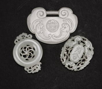 Late Qing/Republic - A group of three green white jade: Late Qing/Republic A group of three green white jade pendants H:5.5 - 6 cm. (2 1/8 -2 3/8 in.) 晚清/民國 青白玉佩一組三件(ह