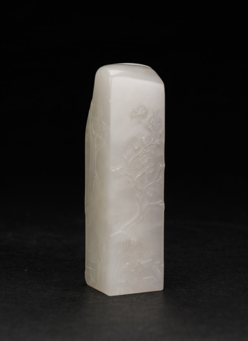 A soapstone seal carved figure and landscape seal: A soapstone seal carved figure and landscape seal 2.5 x 2.5 x 10 cm. (1 x 1 x 3 7/8 in.) 壽山凍石薄意人物，山水橢形章