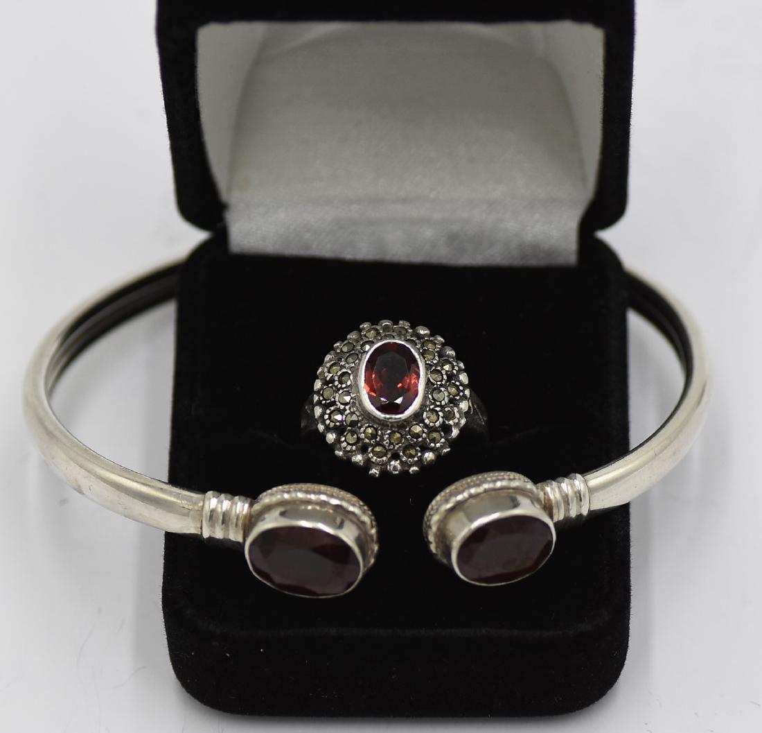925 Silver and garnet bracelet and ring set.: Ring has 925 silver, garnet and marcasite size 6 and weighs 0.18 OZT. bracelet is 925 silver and garnet is 7.5" and weighs 0.50 OZT