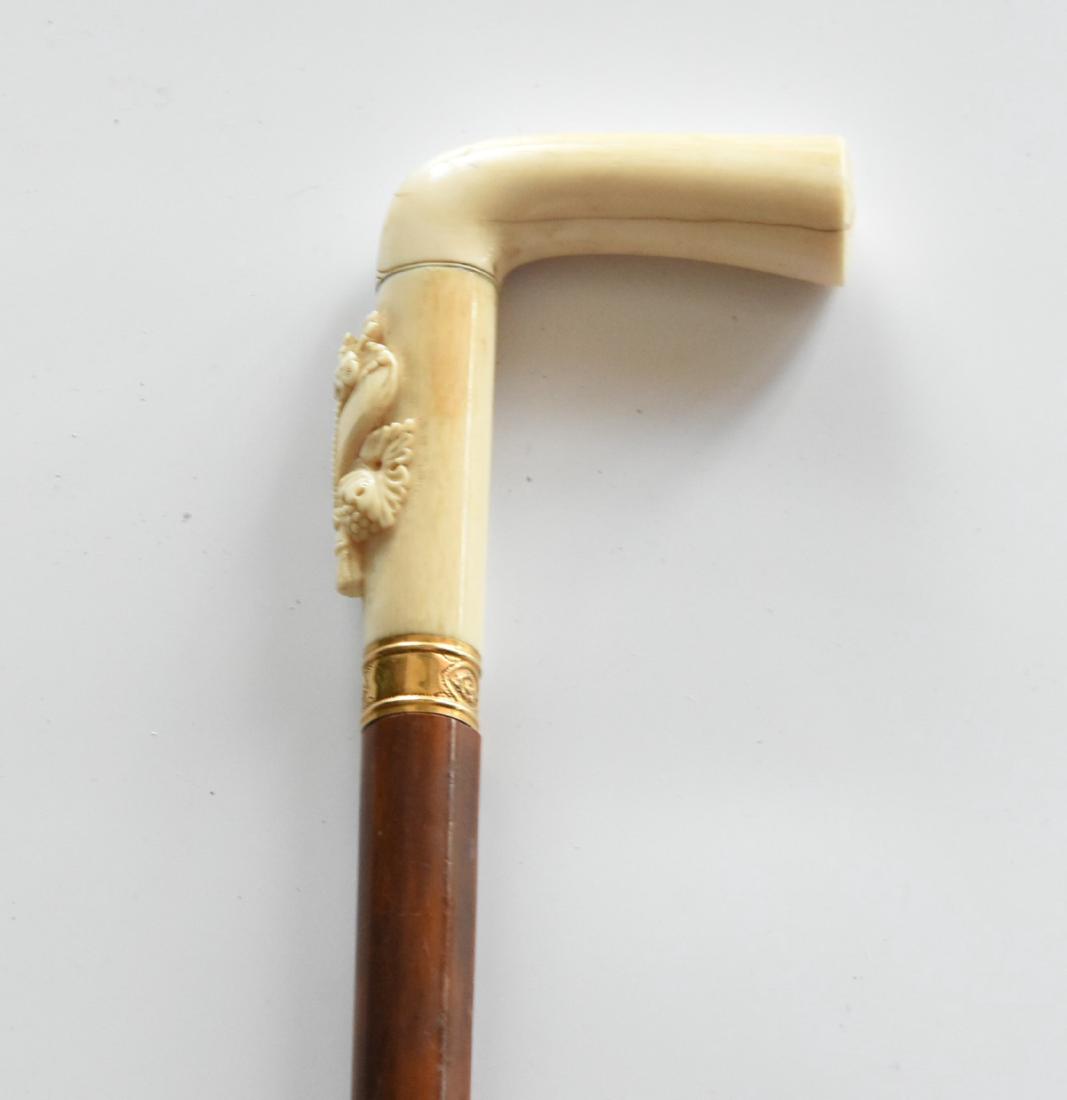Vintage Carve bone Handle Cane With Gold Ring: Vintage Carved bone handle cane with a gold ring. 34"L