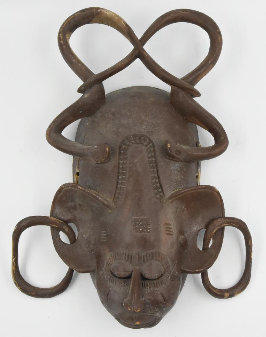 African Mask Carved Wood: Hand carved African mask intertwined snakes and earings. Minor crack in the wood.