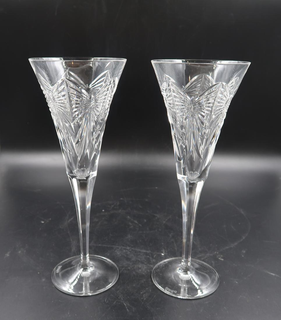 Pair of Waterford champagne glasses: [9.5in./3.5in.] (Slight crack on rim)