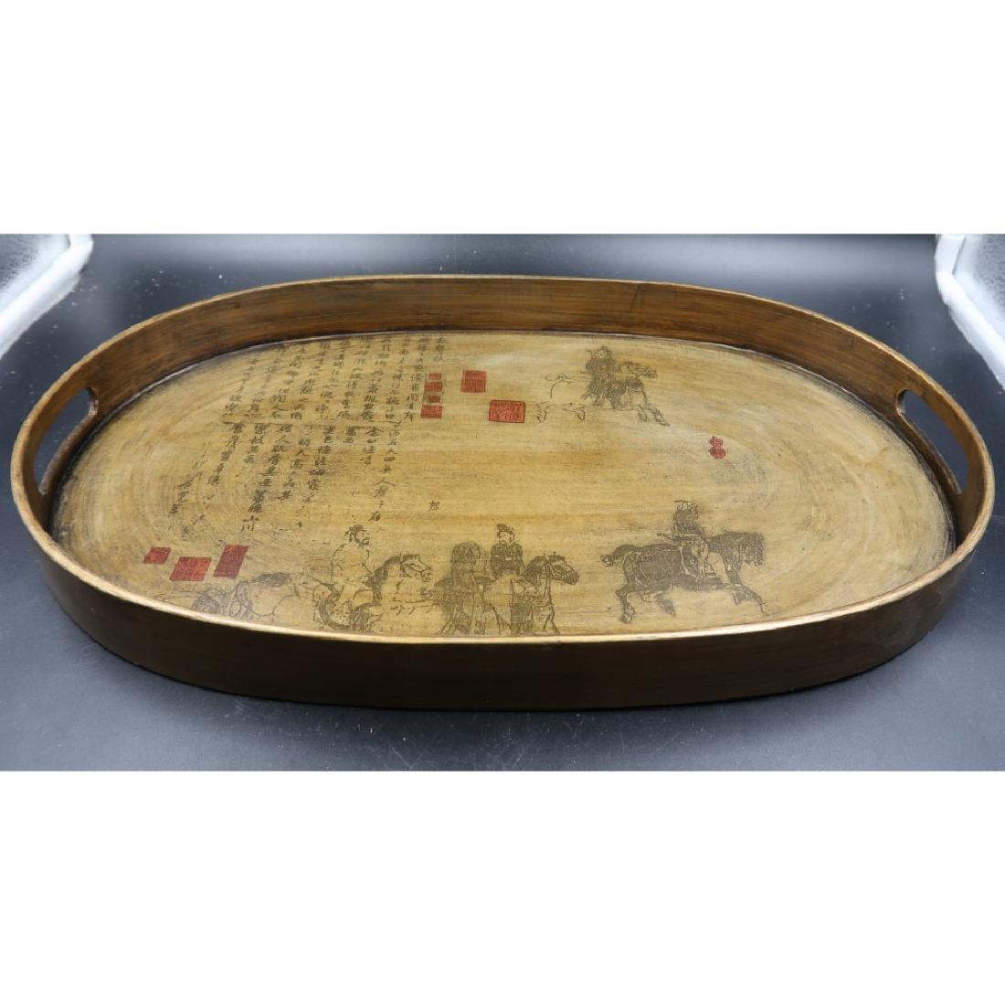 Oval gold-toned wooden tray with Chinese writing and: 18" long x 12" wide
