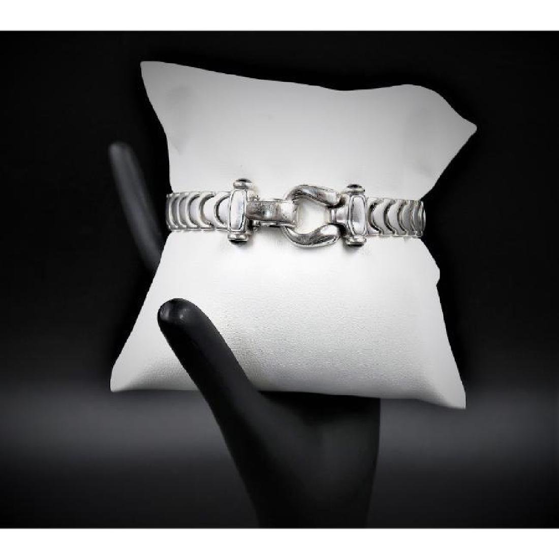 14K White Gold with 4 .25K Sapphire Italian Bracelet: 14K White Gold with 4 .25K Sapphire Italian Bracelet 8" Long 3/4" wide 26.6 Grams