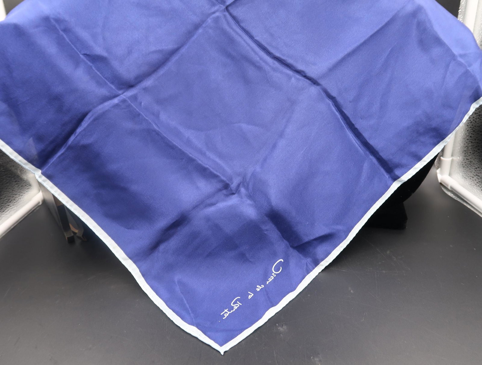 Oscar De La Renta Scarf Blue color: Used as a purely decorative accessory in a suit pocket, it is then called a pocket square.