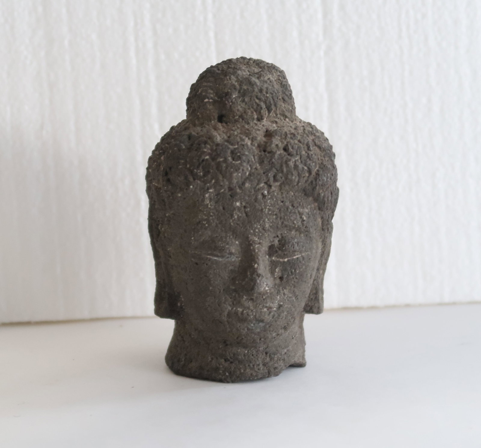 The Meditating Buddha Head: The Meditating Buddha Head is a great addition to any deccor. It helps to set a tranquil mood and a sense of calmness. Size: 5" x 3" x 3".