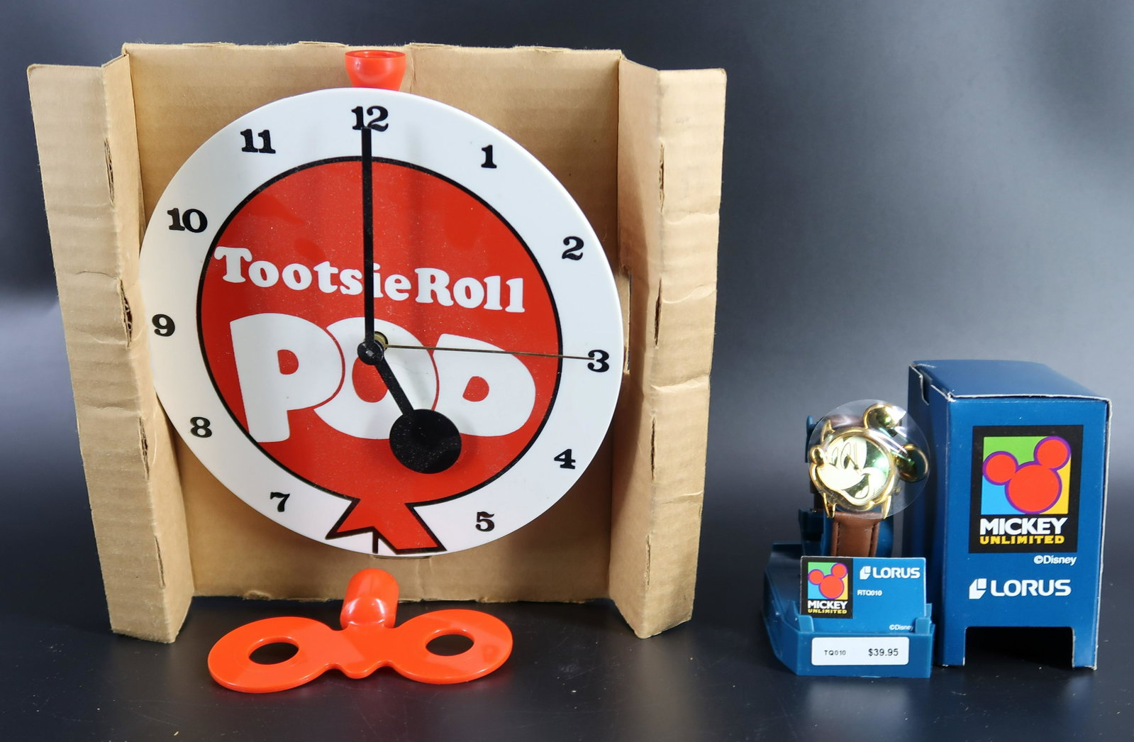 ToothsieRoll Clock & Mickey Lorus: ToothsieRoll Clock(windup clock) size: 6 3/4" round & Mickey Lorus(never been used).