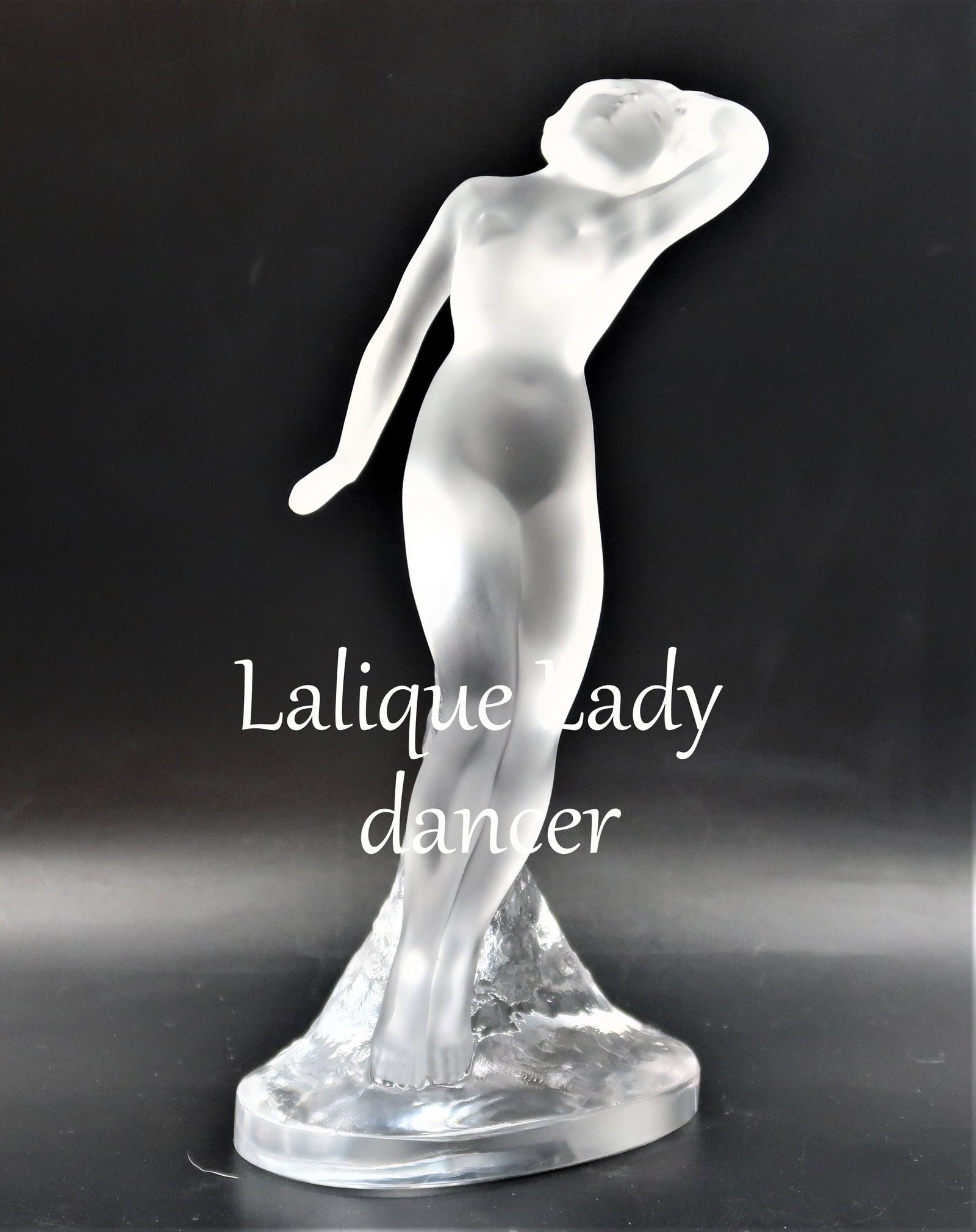 Lalique LADY DANCER: Lalique France Crystal Figurine DANSEUSE NUDE WOMAN LADY DANCER ARM OUT UP Mint 9 1/2" high Lalique sculpture of a nude dancer - arm down. This model is one of a series of nude dancer sculptures, orig
