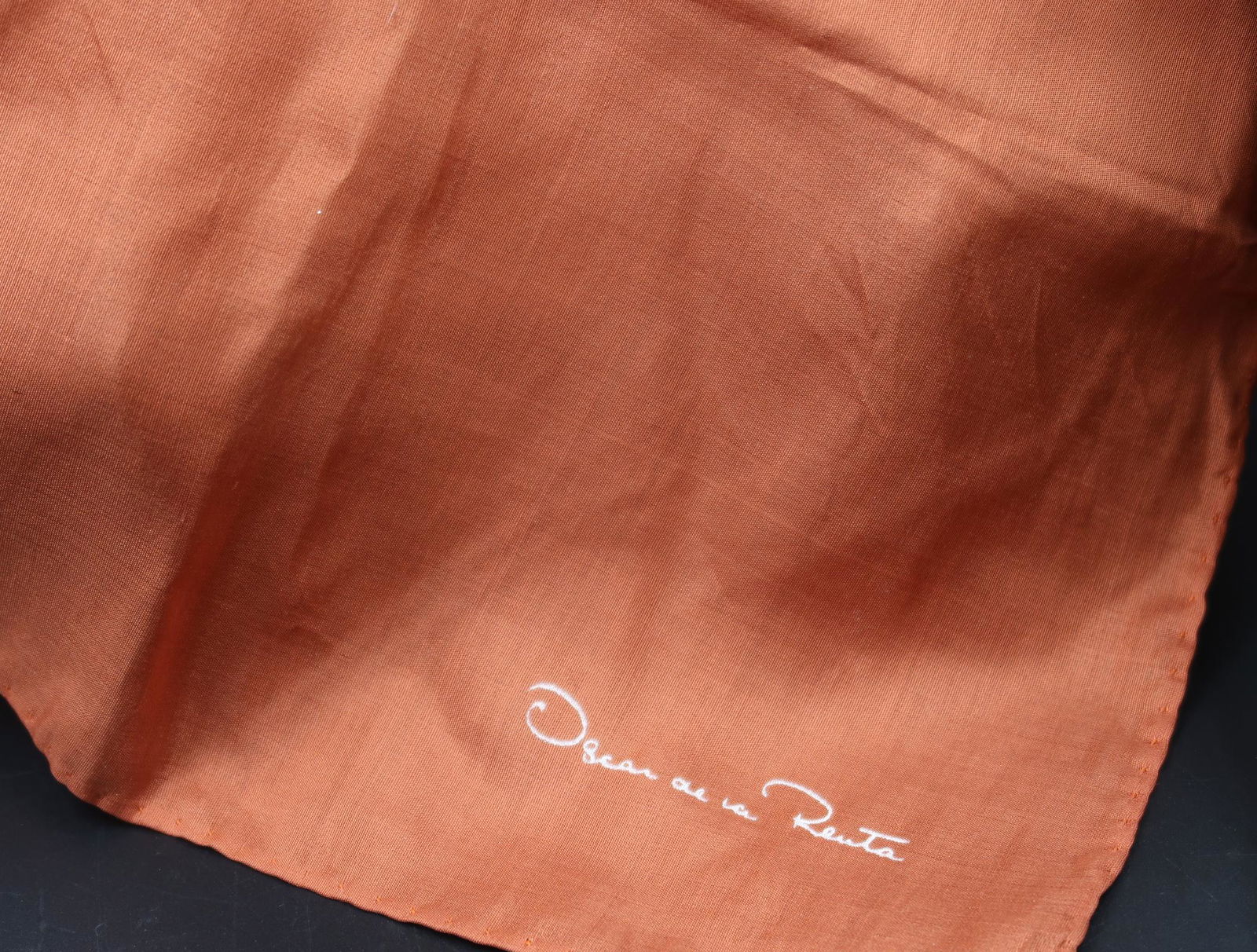 Oscar De La Renta Scarf Peach: Used as a purely decorative accessory in a suit pocket, it is then called a pocket square.