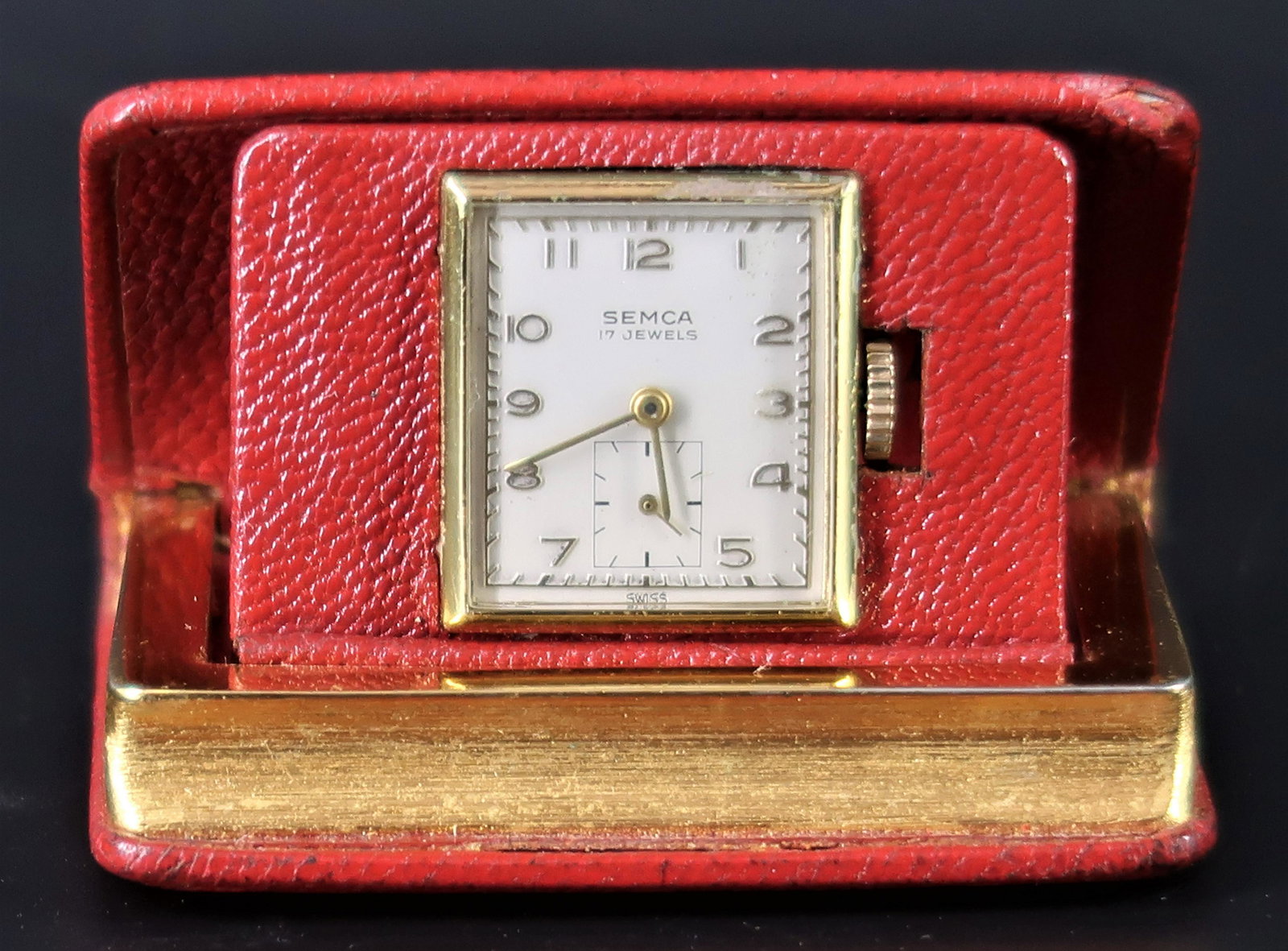 Vintage Book of Time SEMCA 17 Jewels: Rare Swiss made movement. Good working condition Charming fold out clock, in the shape of a bo leather on Metal Made USA nice Display piece Wine movement 2 1/2" X 2"