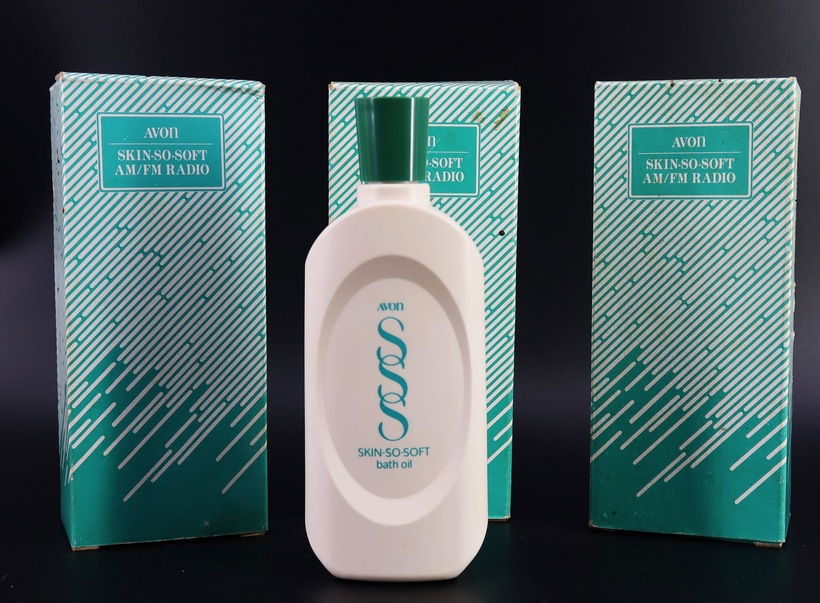 3 pcs. Avon Skin-so-Soft AM/FM Radio: Made in China exclusively for Avon Product inc. Distribution @ Avon 1990.(FSC#5858-1. Size: 8" x 3" x 2 1/2".