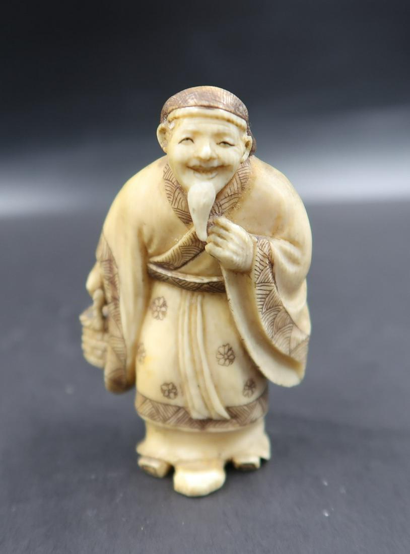 Netsuke Japanese Carved Man with Basket (1 of 4)