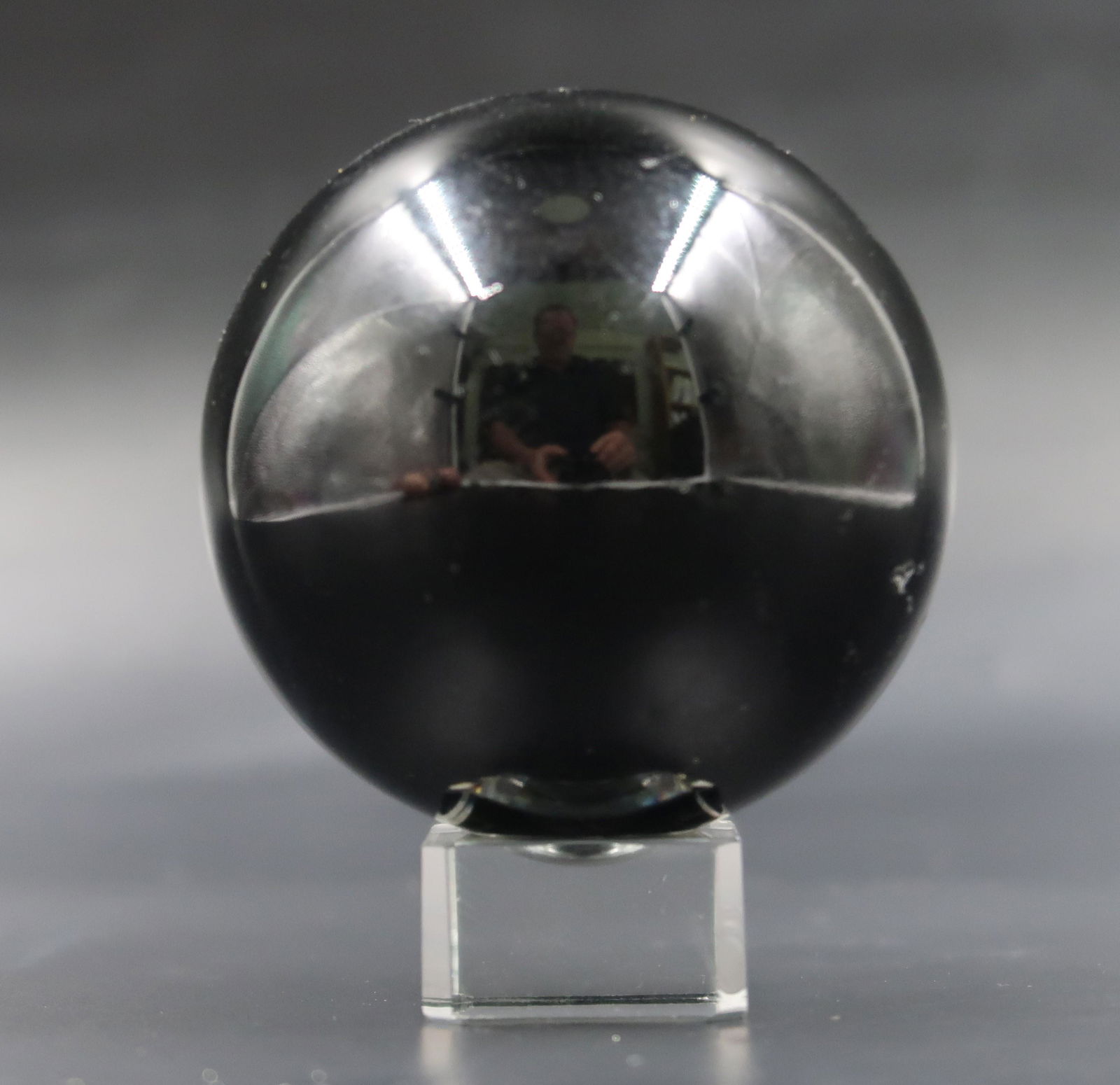 Black Granite Sphere: Size: 2 1/2" x 1 1/2" Black Granite Sphere Polished on stand