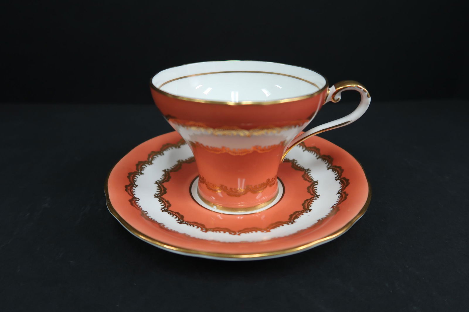 Aynsley England Bone China Tea Cup and Saucer: Size of Tea Cup: 2 3/4"H x 3 1/2"W Size of Saucer: 5 1/2"W