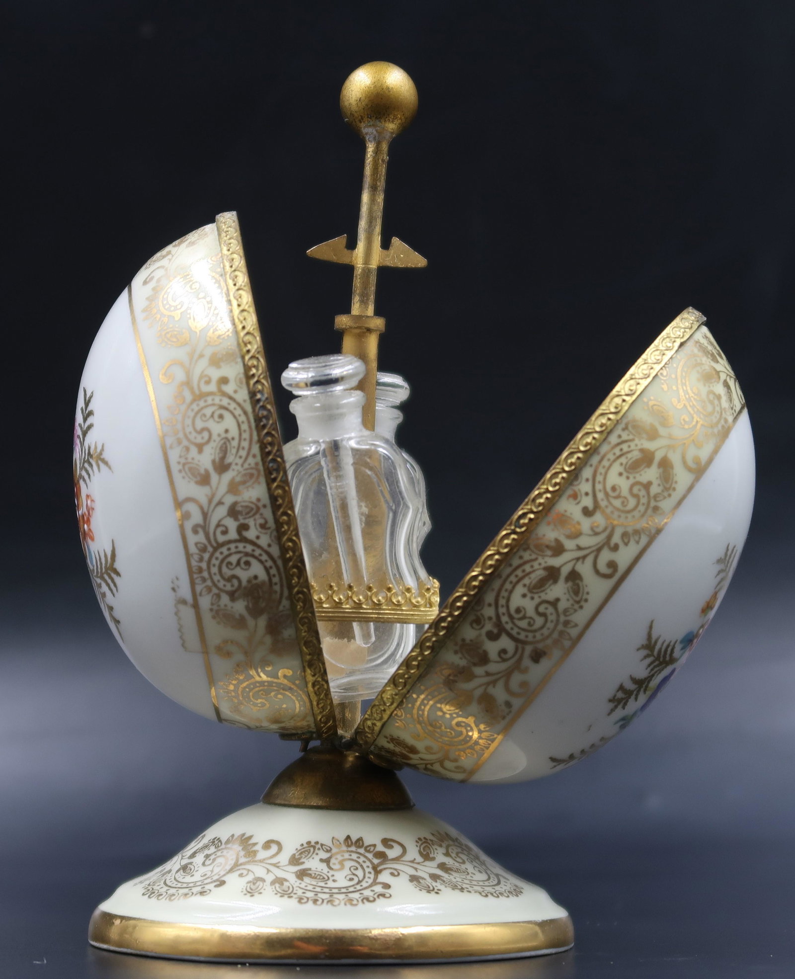 Limoges Egg Porcelain D' Art Perfume Container: Size: 5 1/2" x 3"Limoges Egg Porcelain D' Art Perfume Container with perfume bottle inside, in the style FabergÃ© Egg