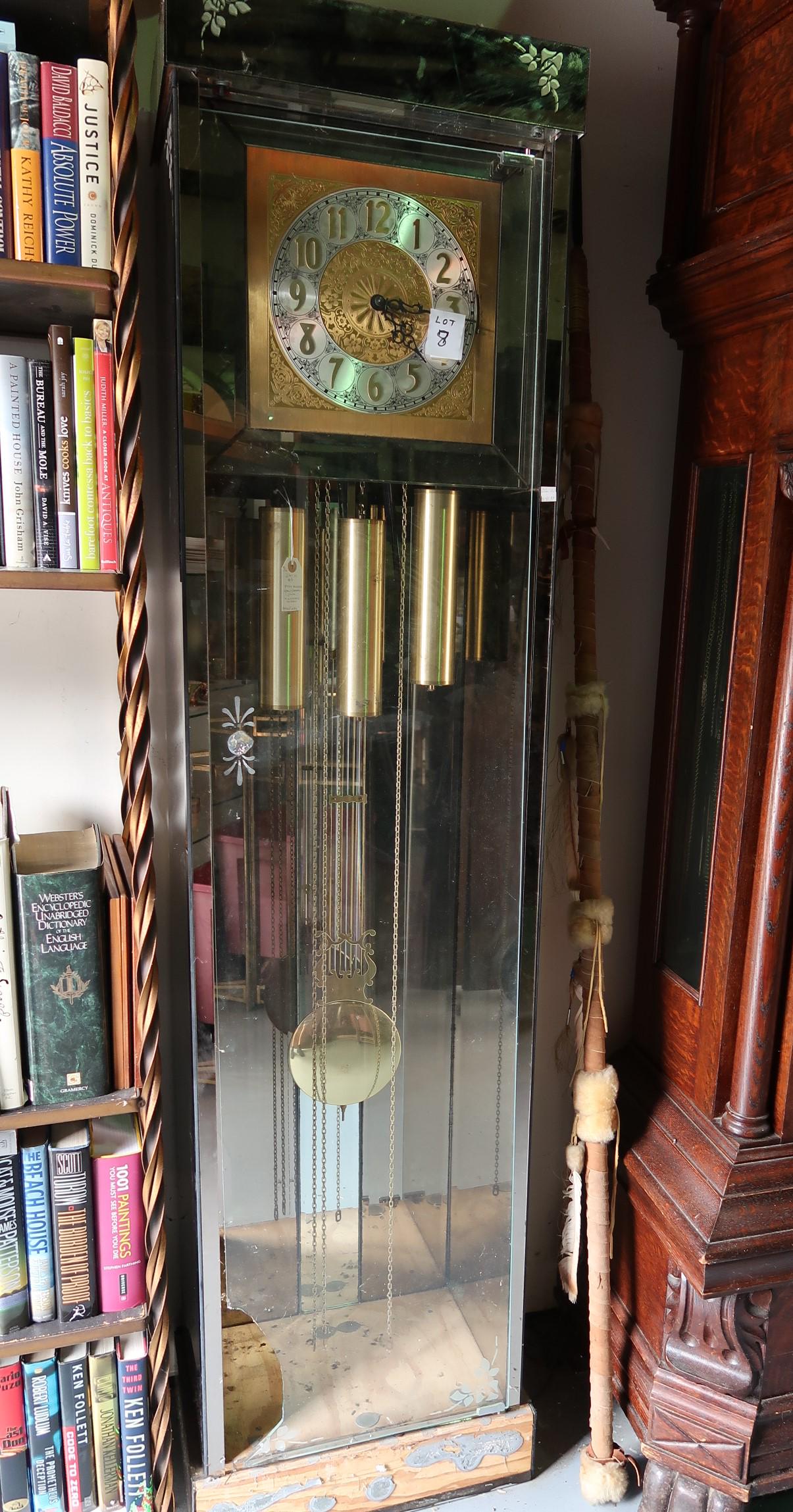 Antique Grandfather Clock: Glass, Mirrored, Brass and Chrome. Size: 76"H x 19"W x 12 1/2"D. Clock is in working condition, needs new glass door and mirror on the base.
